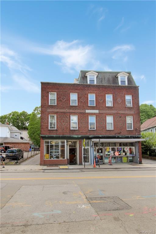 a front view of a building with a street