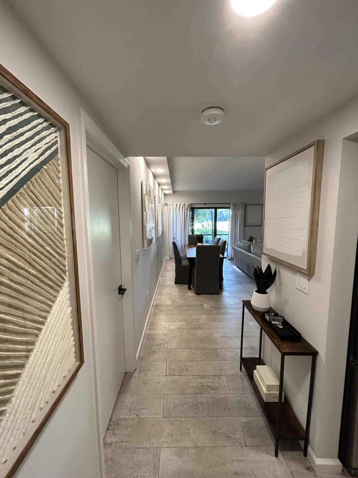 a view of living room with furniture and a flat screen tv