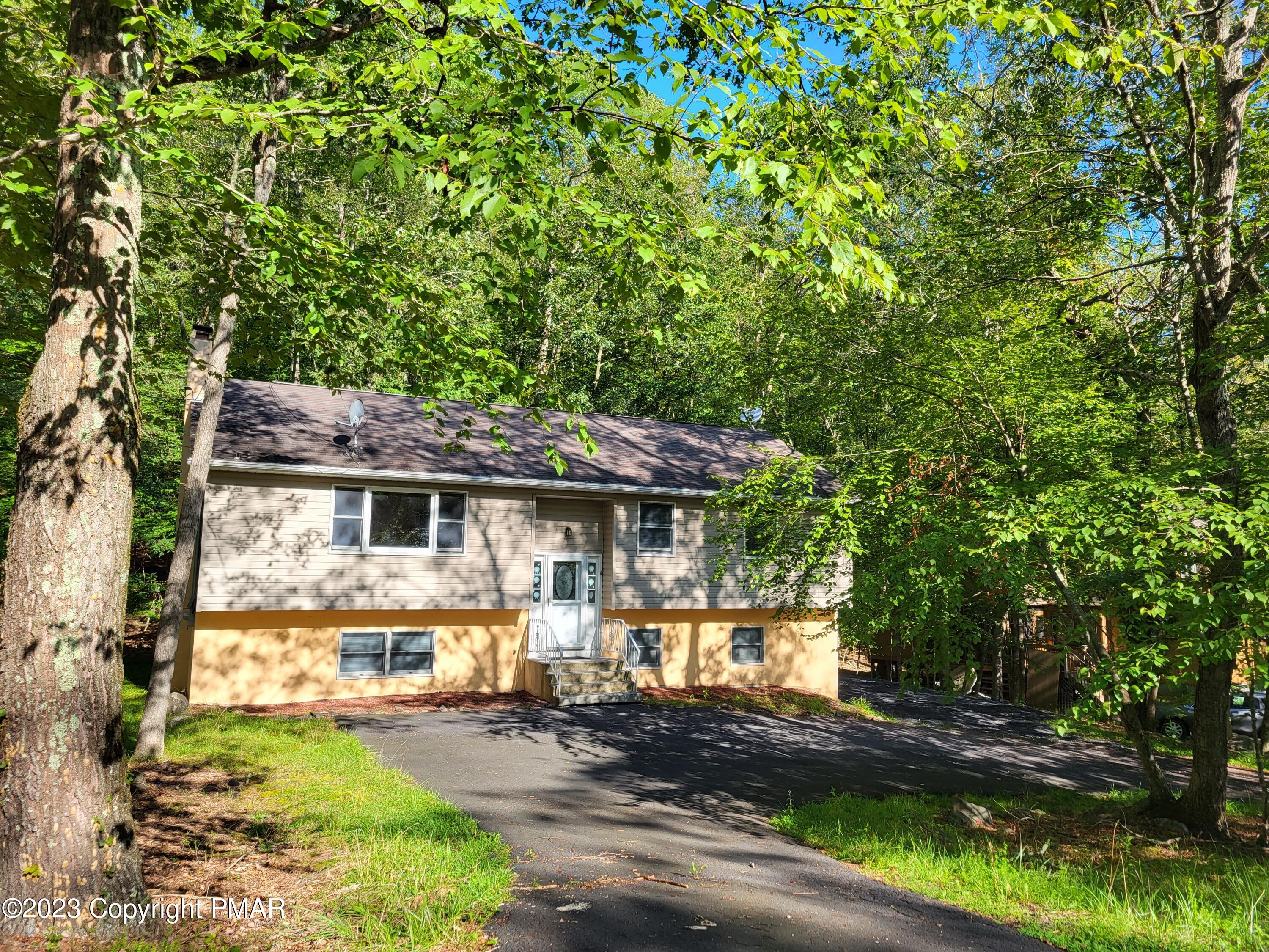 a front view of a house with a yard