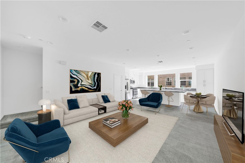 a living room with furniture and a lamp