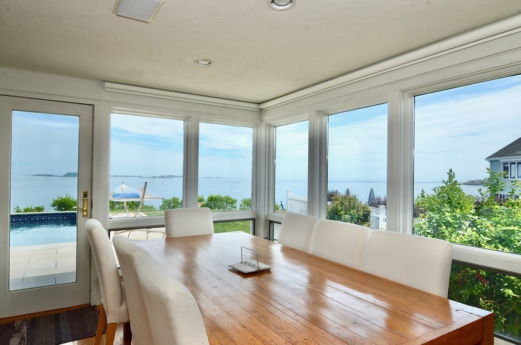 a room with large windows and wooden floor