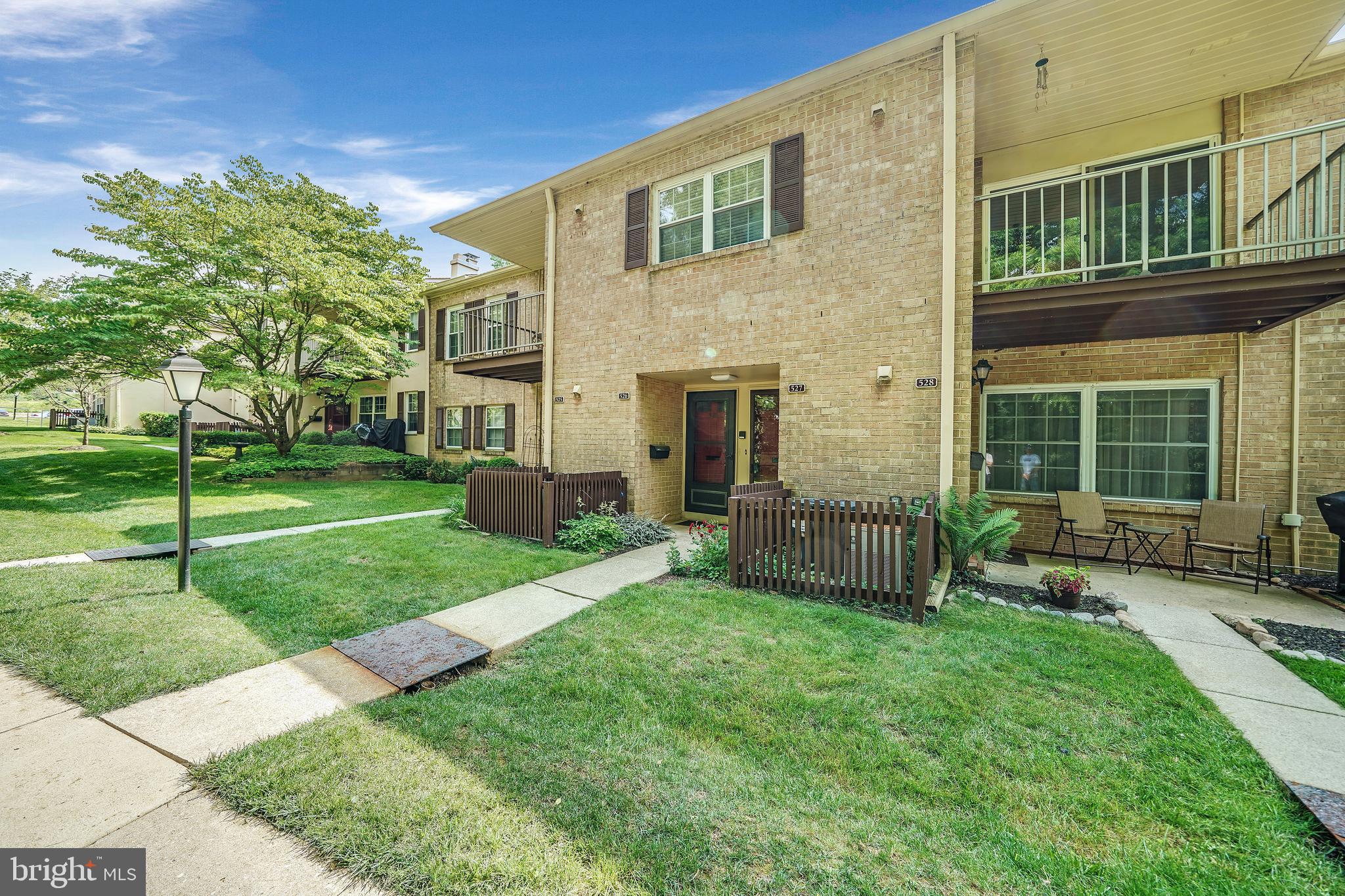 a view of house with a backyard