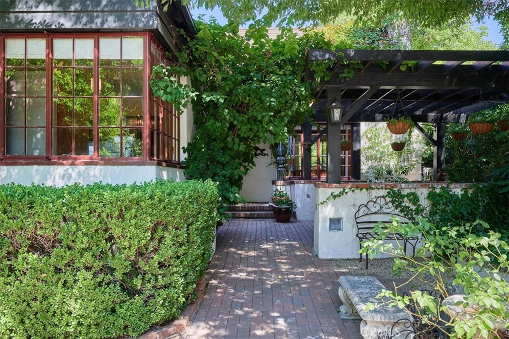 a view of house with backyard and garden