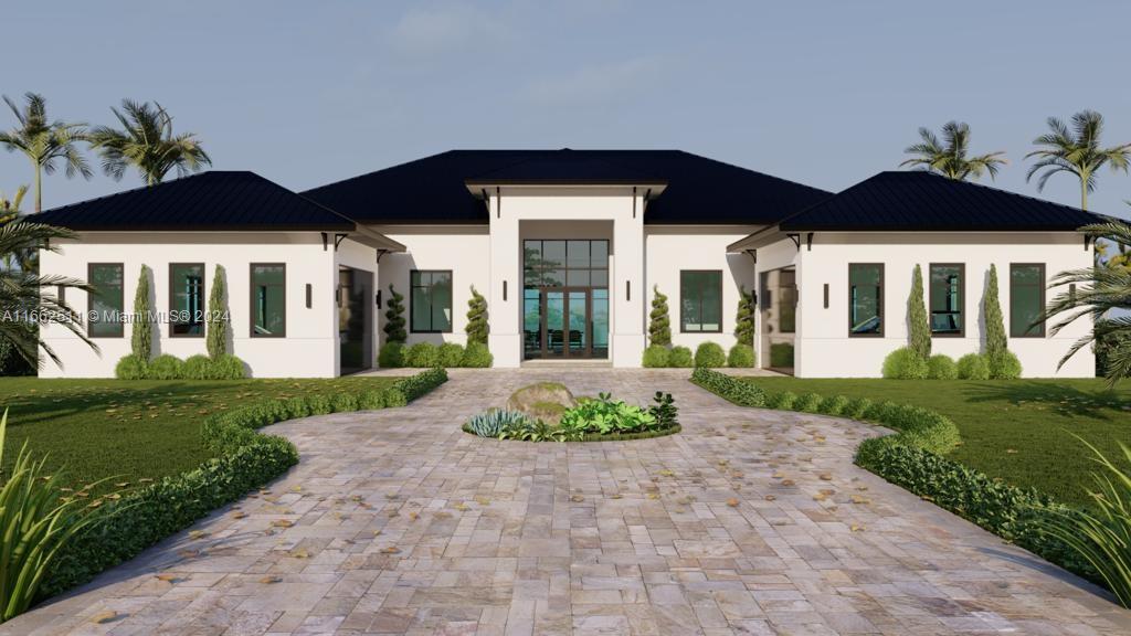 a view of a white house with a big yard and potted plants