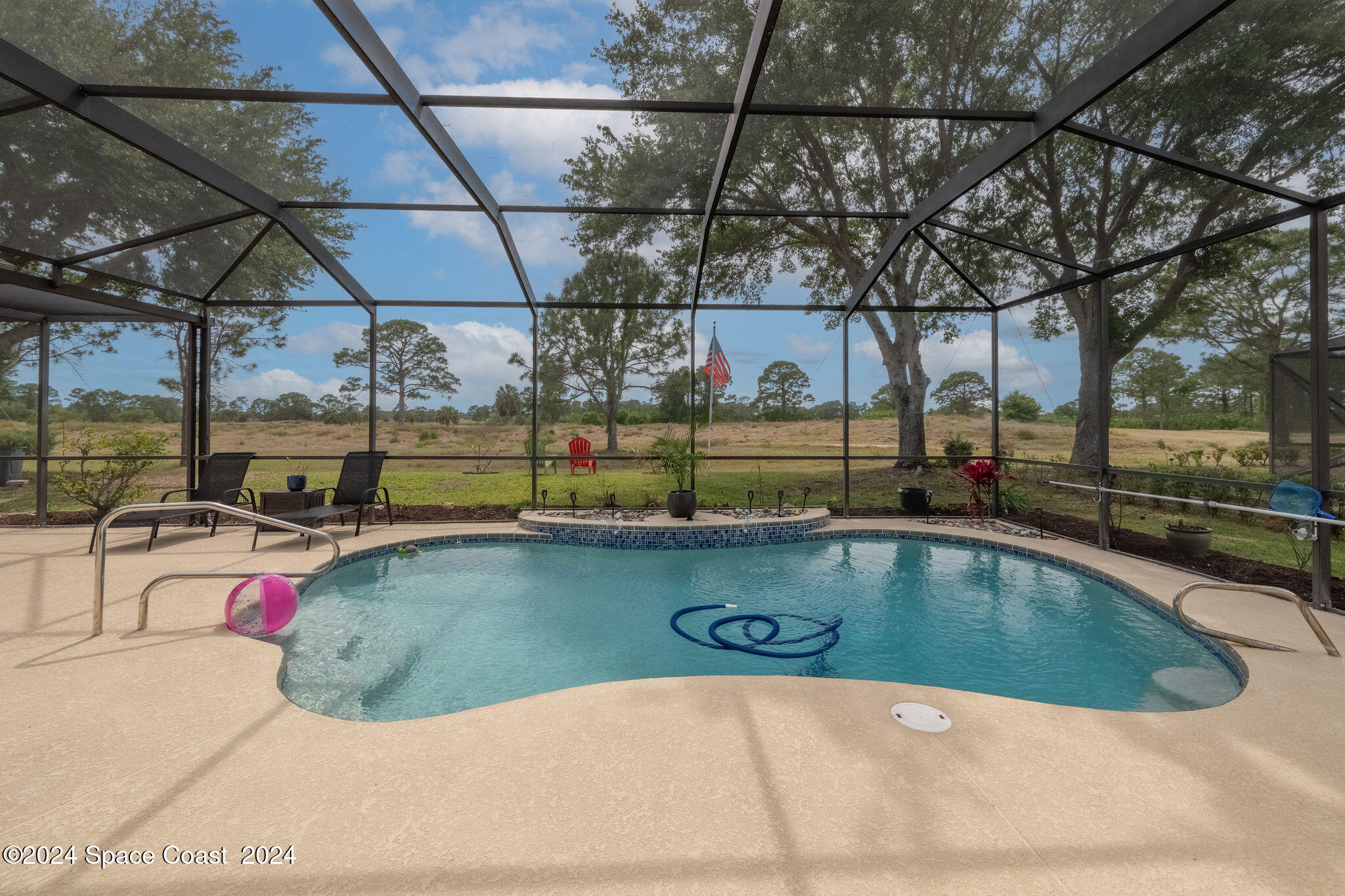 a view of a swimming pool with a patio