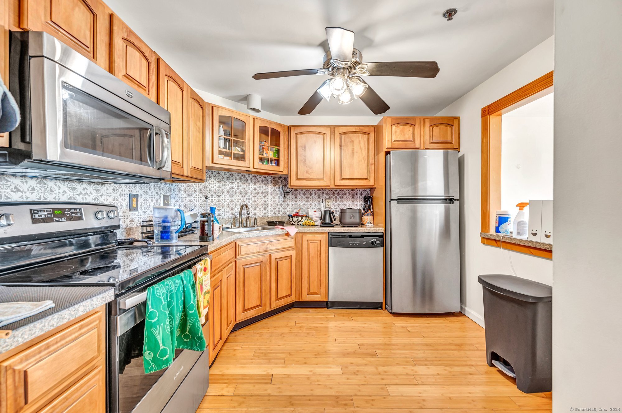 a kitchen with refrigerator a sink and cabinets