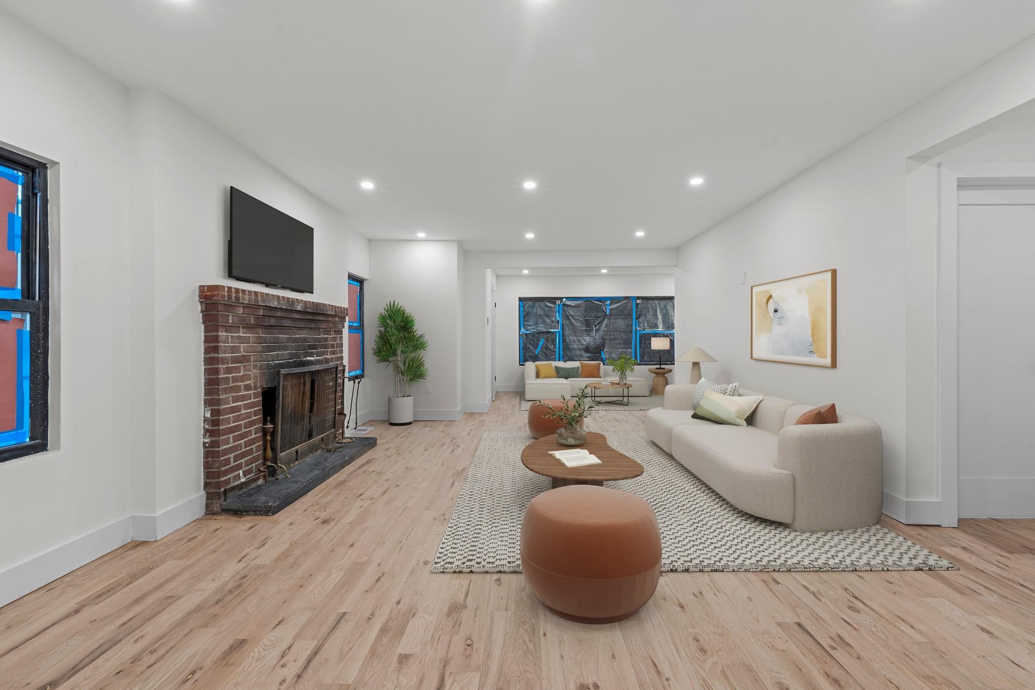 Living room featuring a fireplace and light hardwood / wood-style flooring