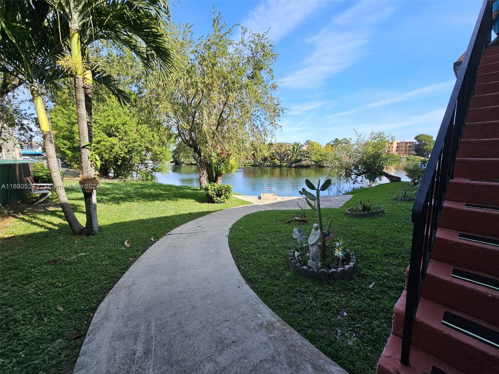 a view of a park with large trees