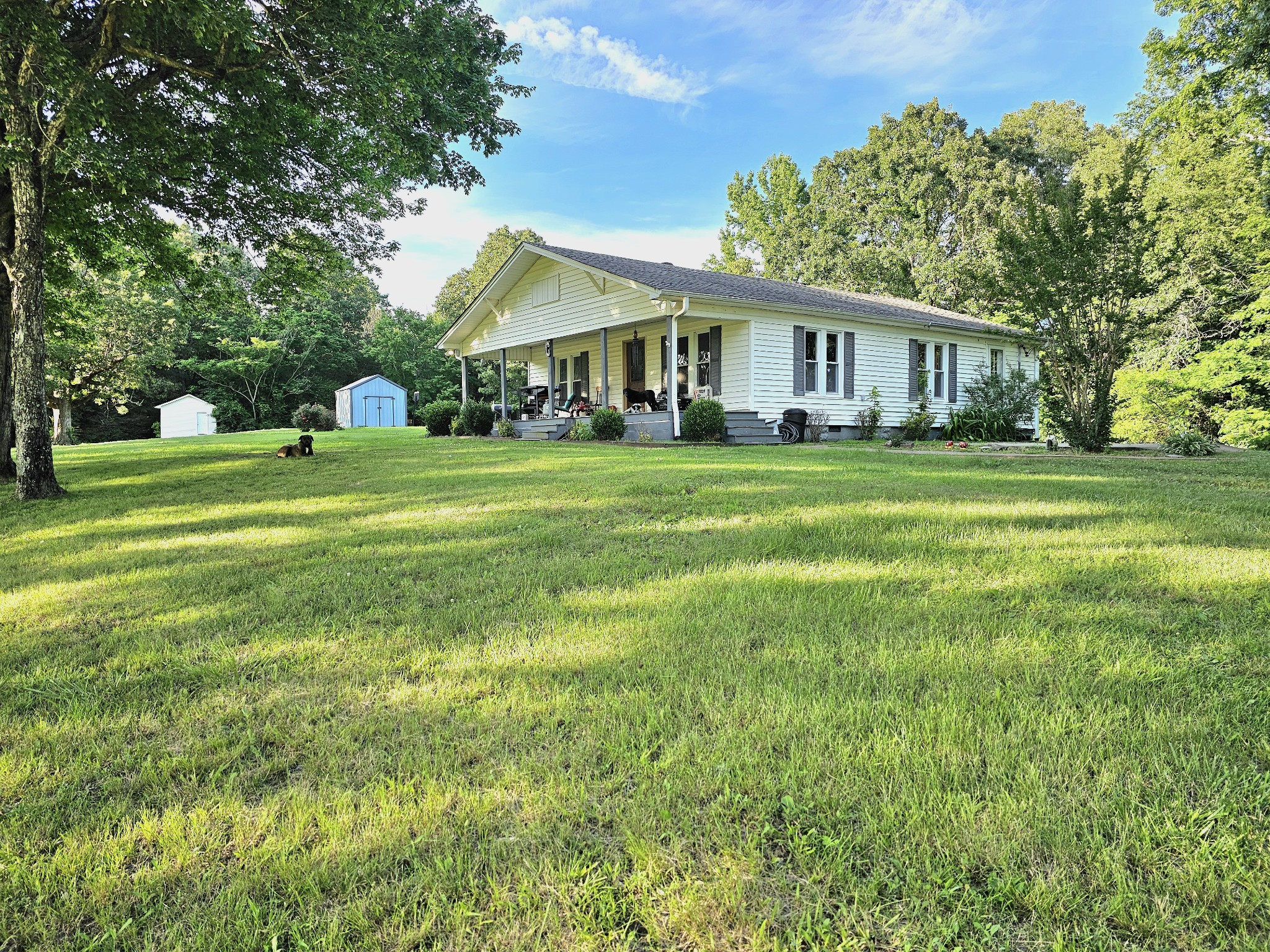 a front view of a house with a garden