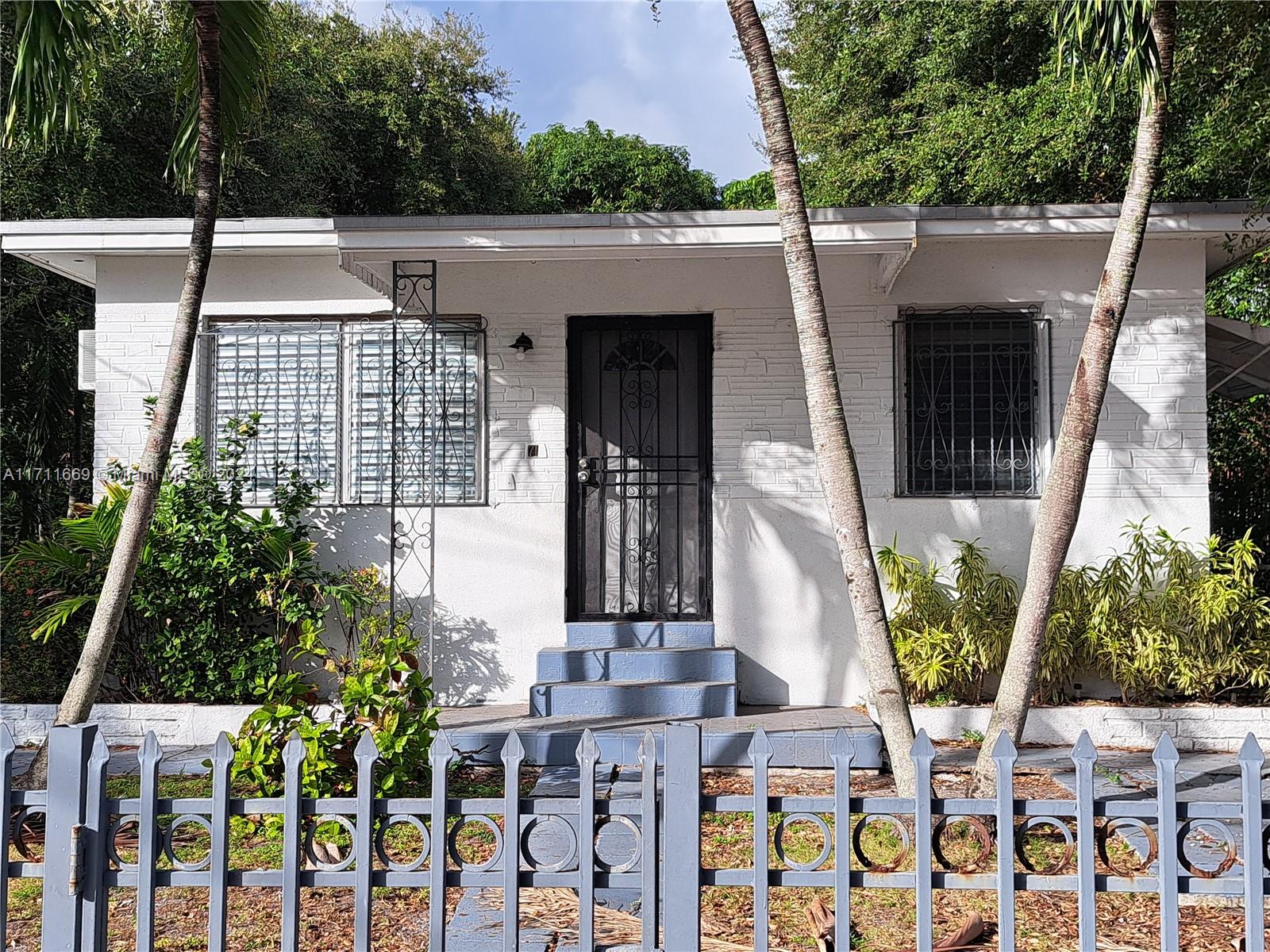 a view of front door and yard