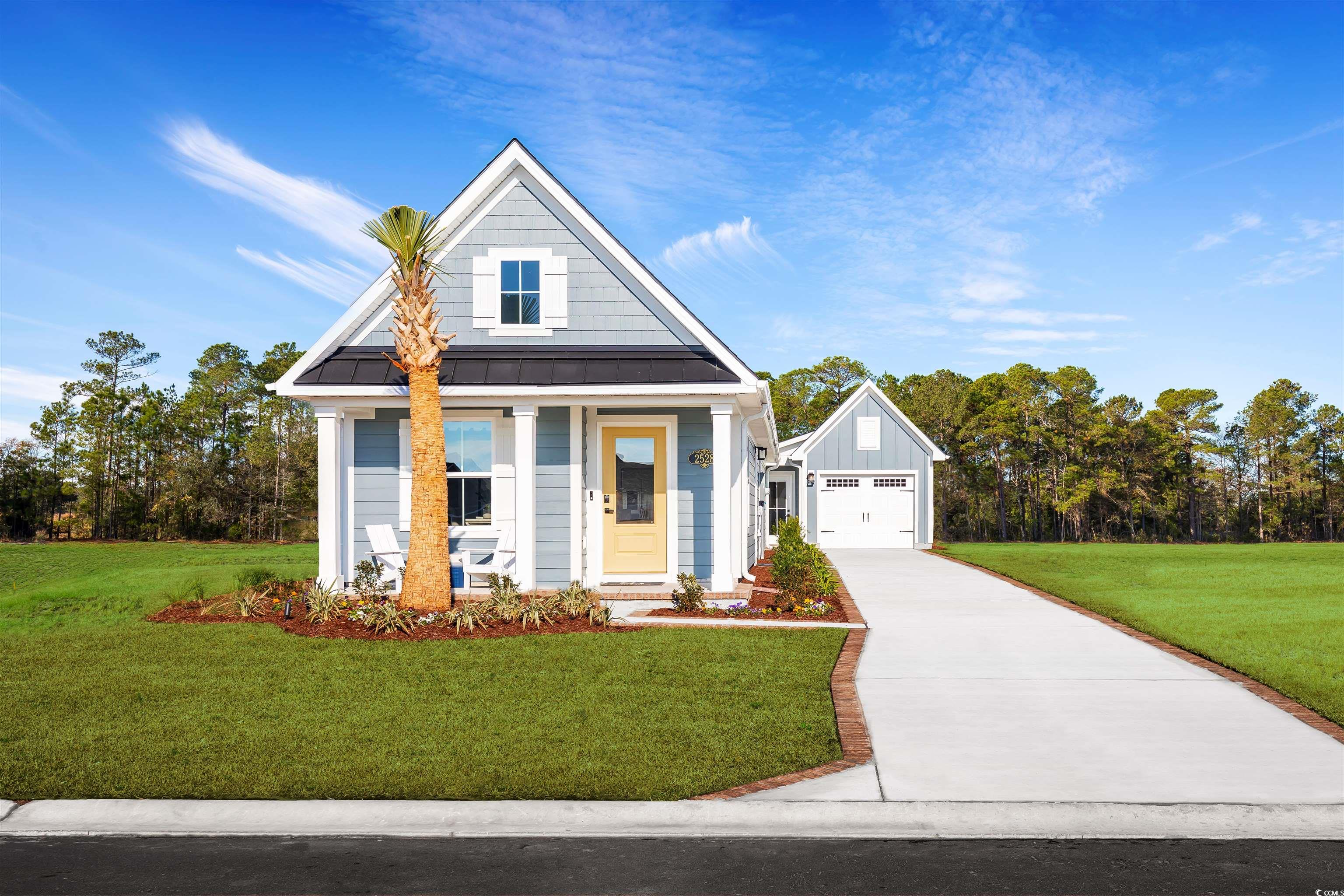 View of front of property featuring an outbuilding