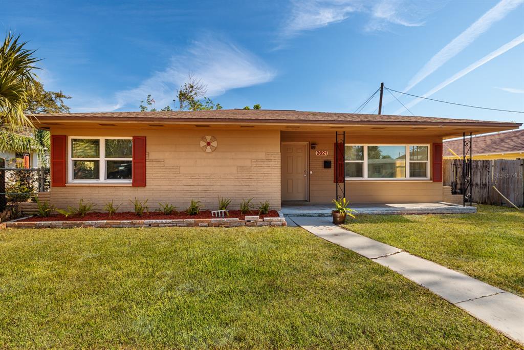 front view of a house with a yard