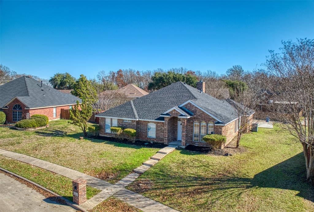 front view of a house with a yard