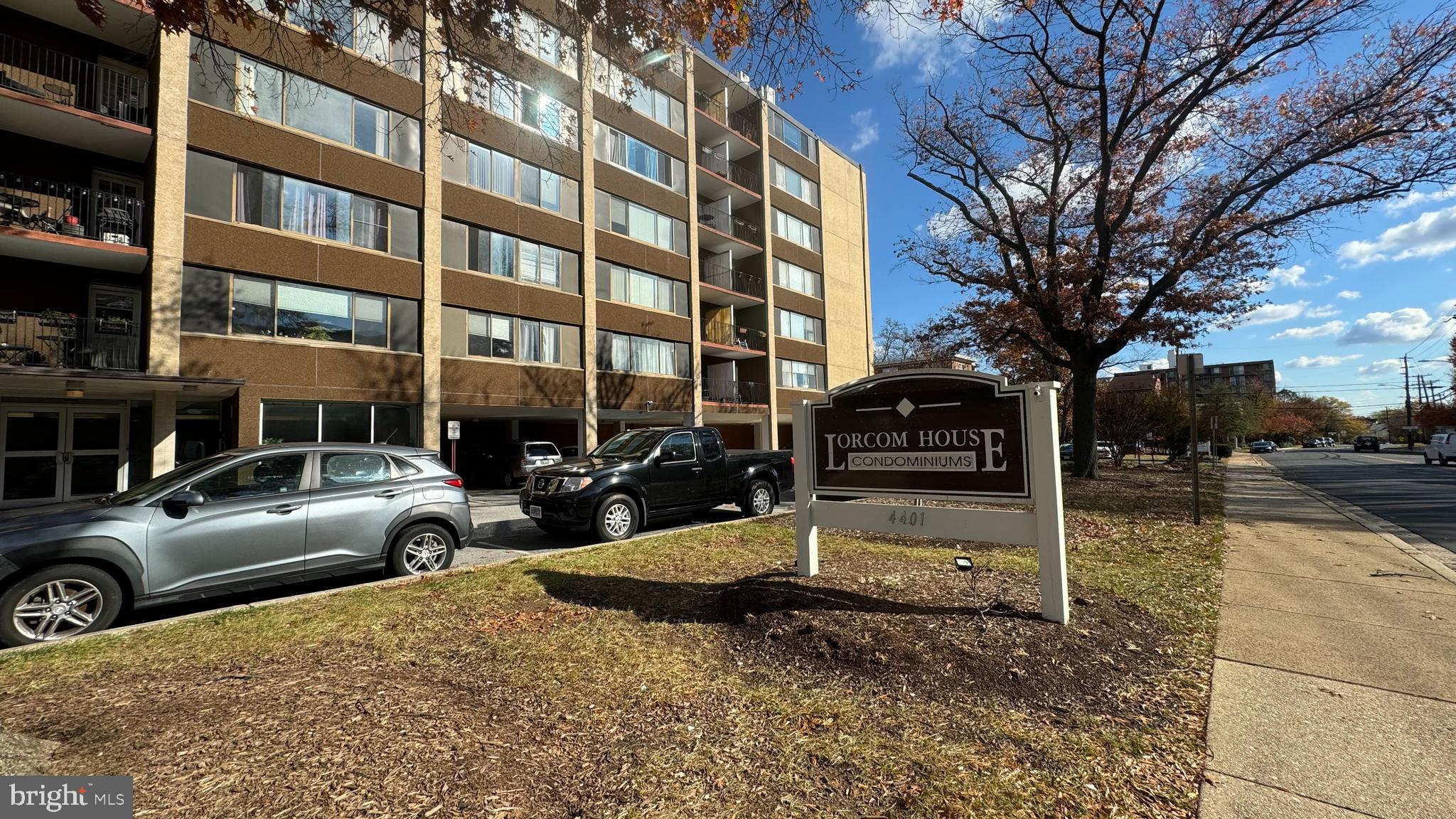 a view of a building with parking space