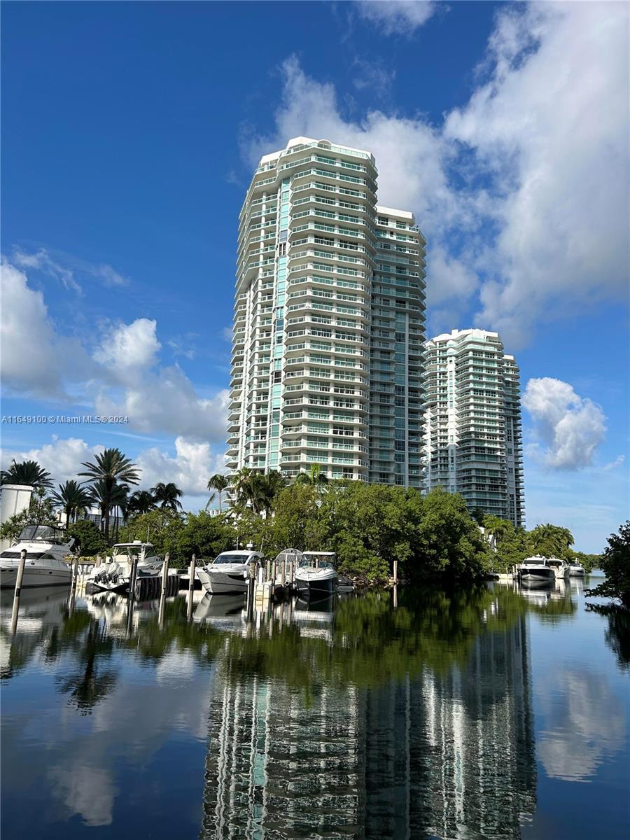 a view of a lake with tall buildings