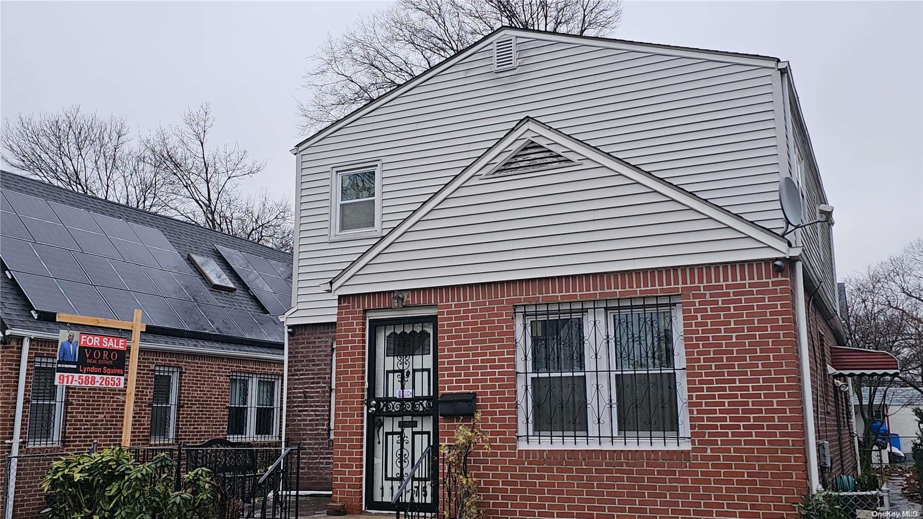 a view of a house with brick walls