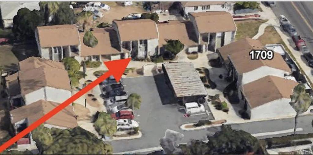 an aerial view of a house stairs and a kitchen