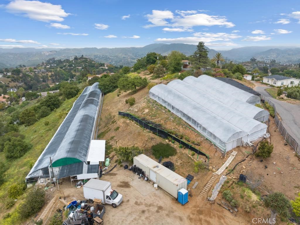 an aerial view of a house with a ocean view