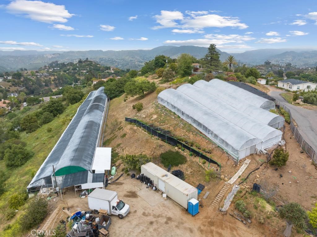 an aerial view of a house with a ocean view