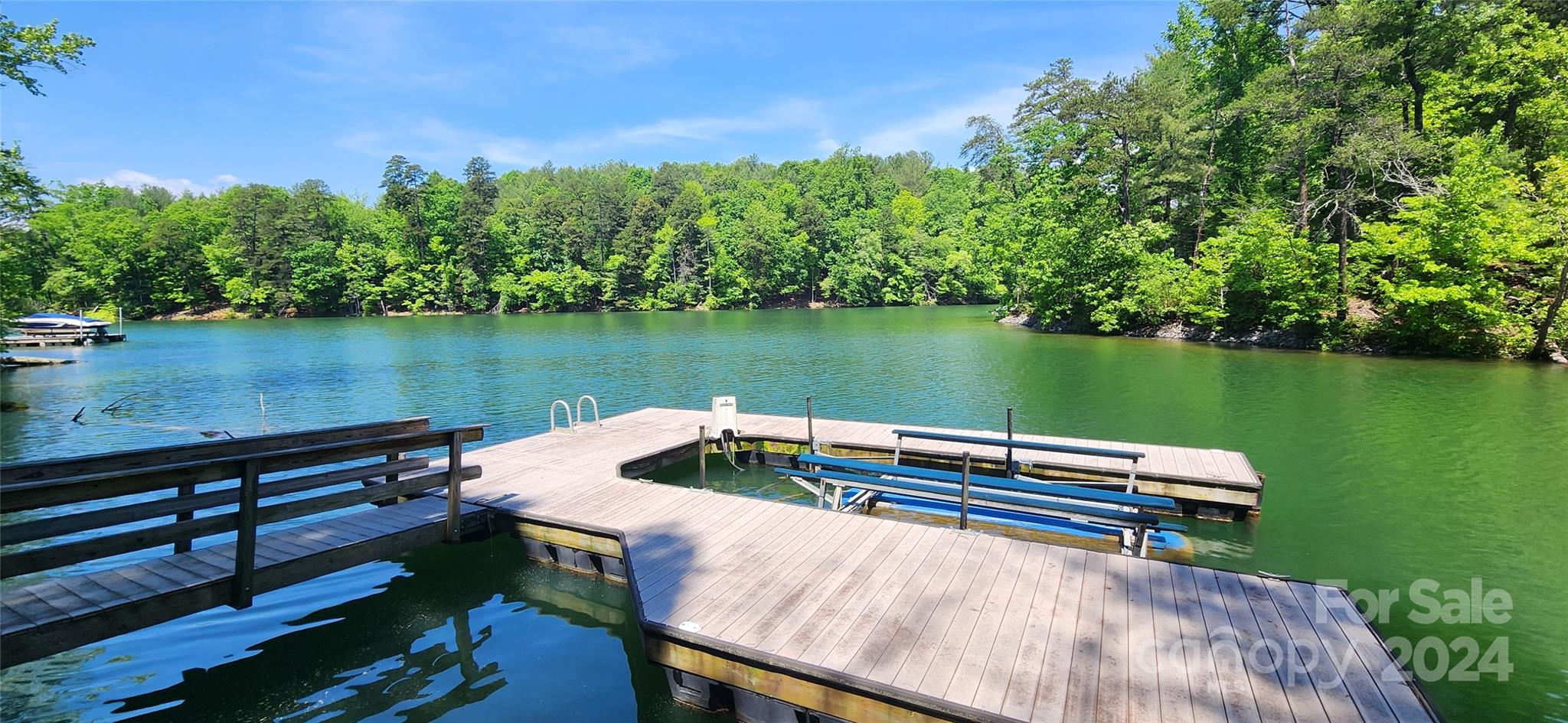 a view of house with outdoor space and lake view