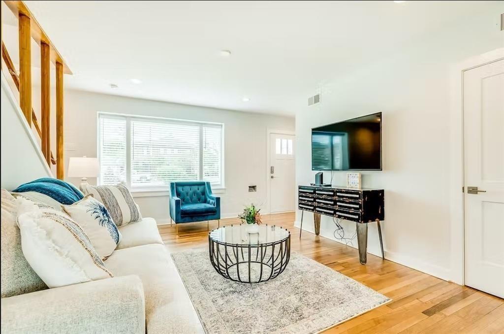 a living room with furniture and a flat screen tv