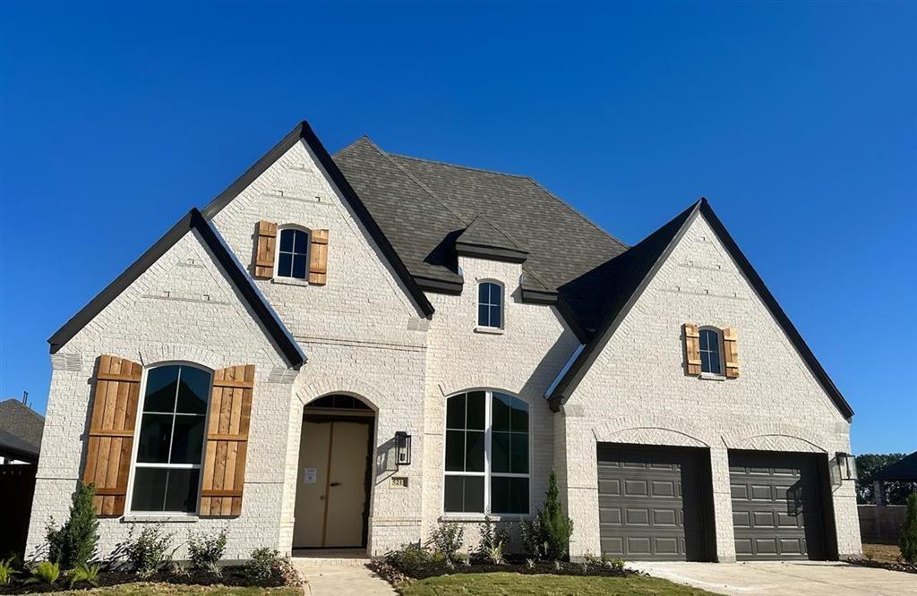 a front view of a house with garage