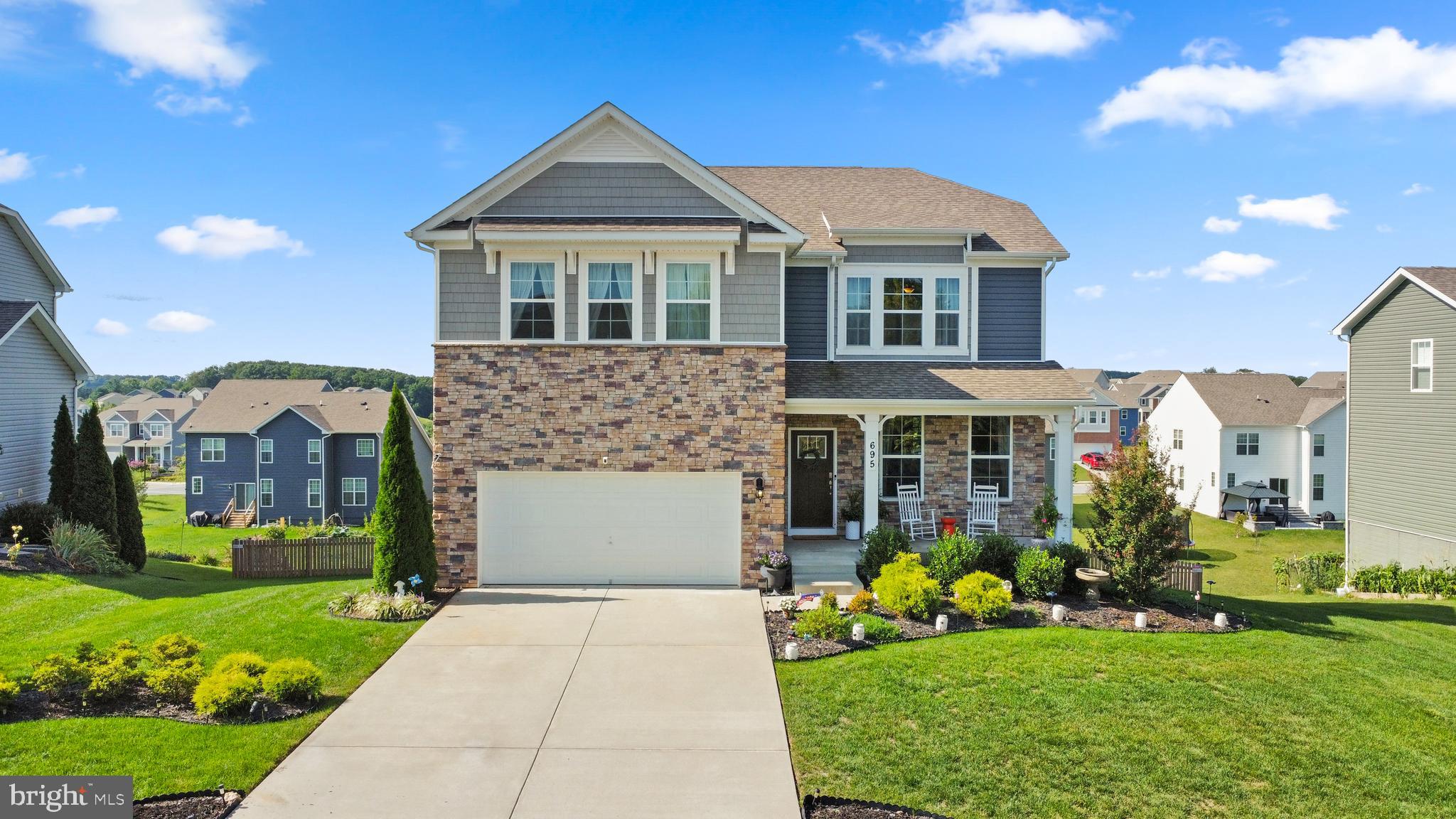 a front view of a house with garden