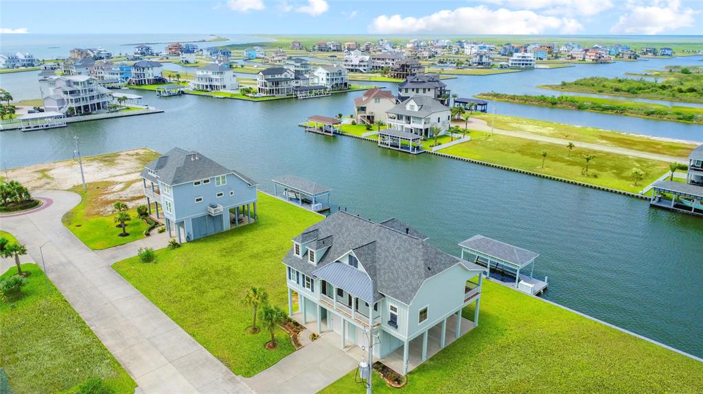 an aerial view of a house with a swimming pool yard and outdoor seating