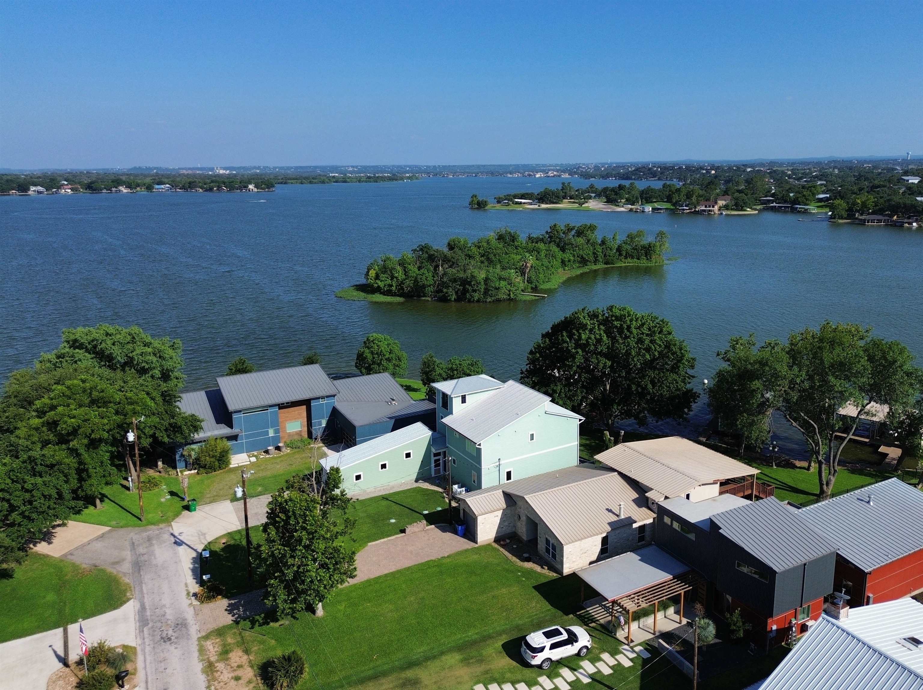 an aerial view of a house with a lake view