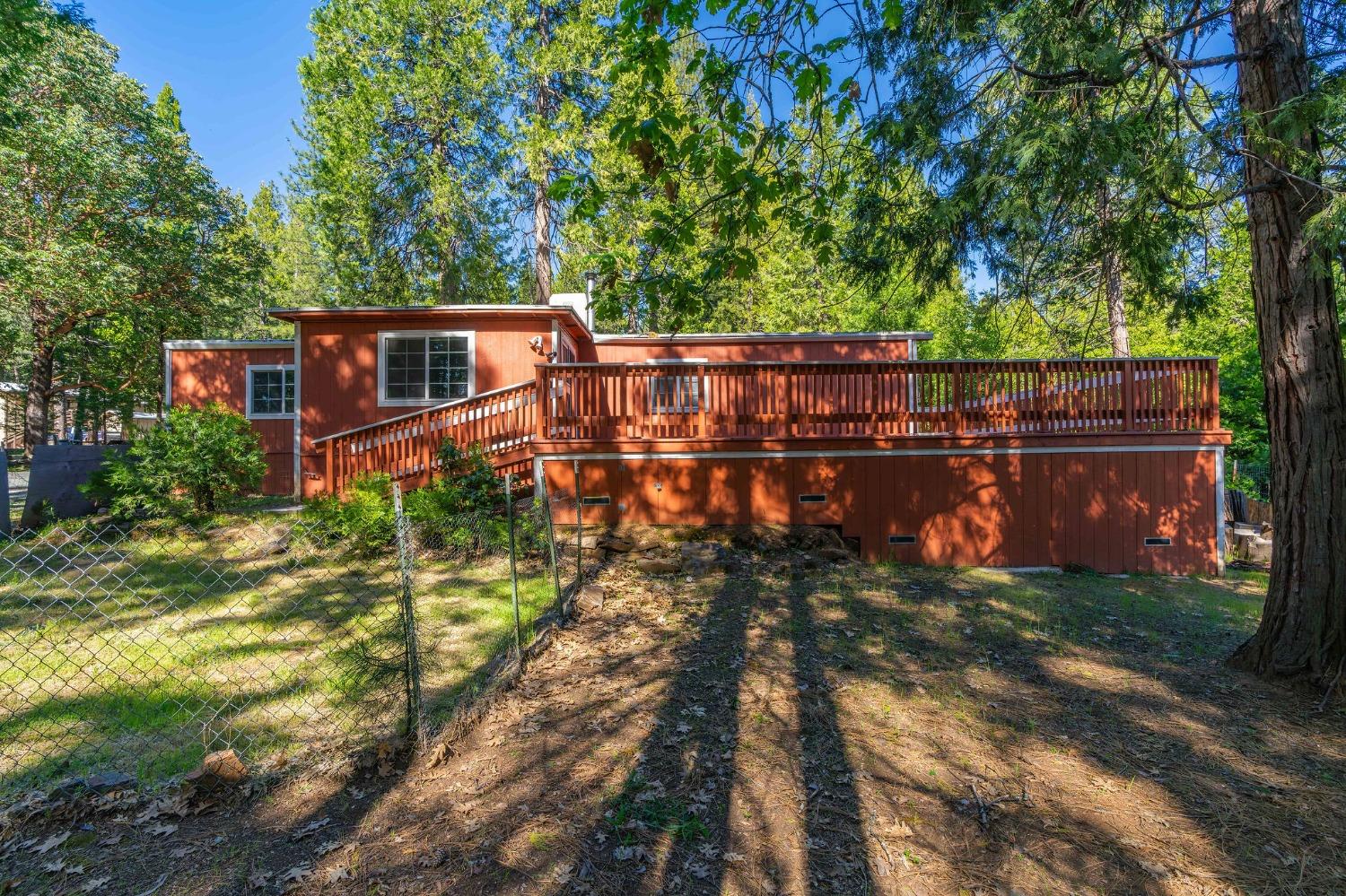 a view of a house with a yard from a balcony