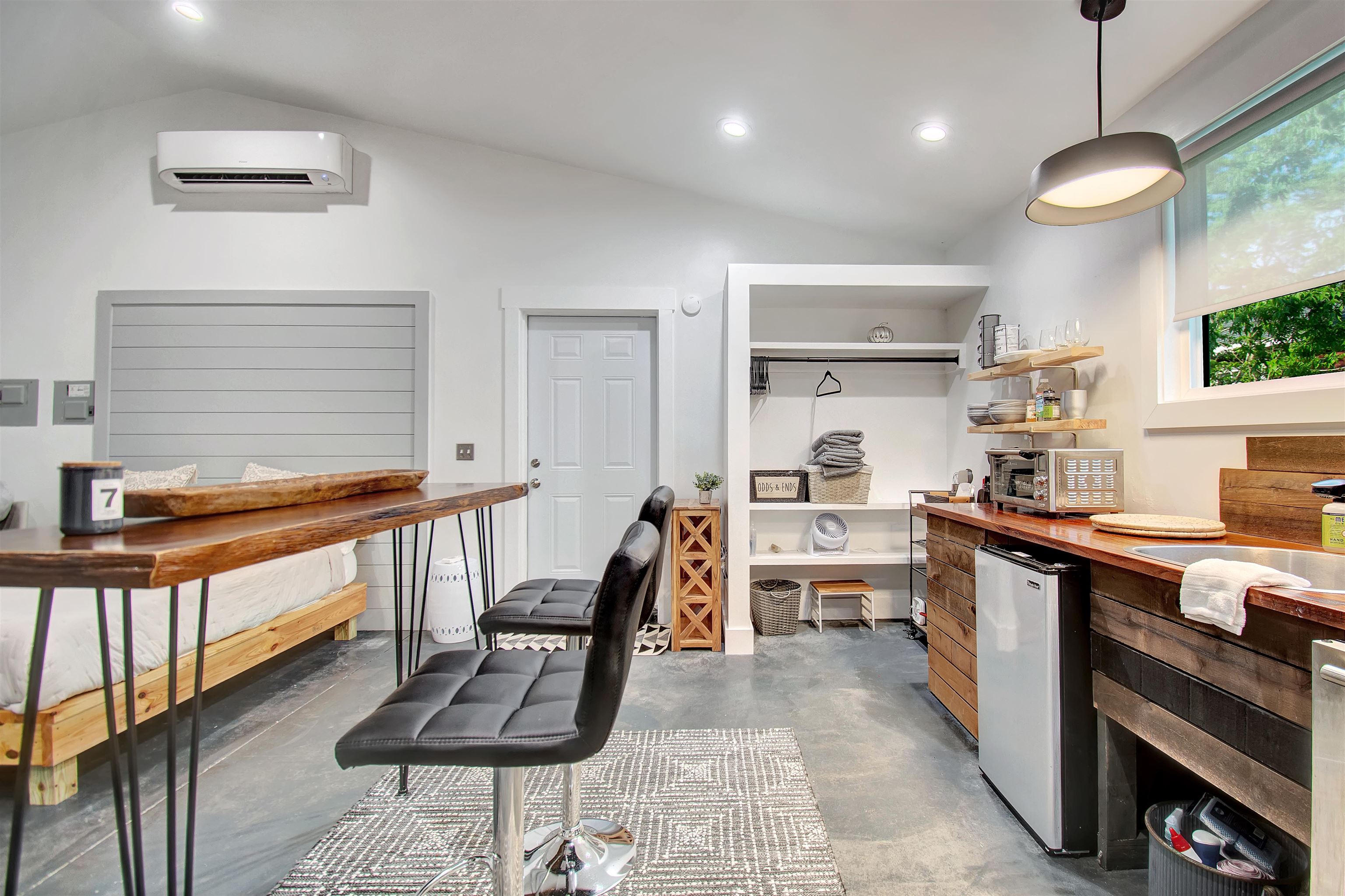 a kitchen with counter top space cabinets and outdoor space