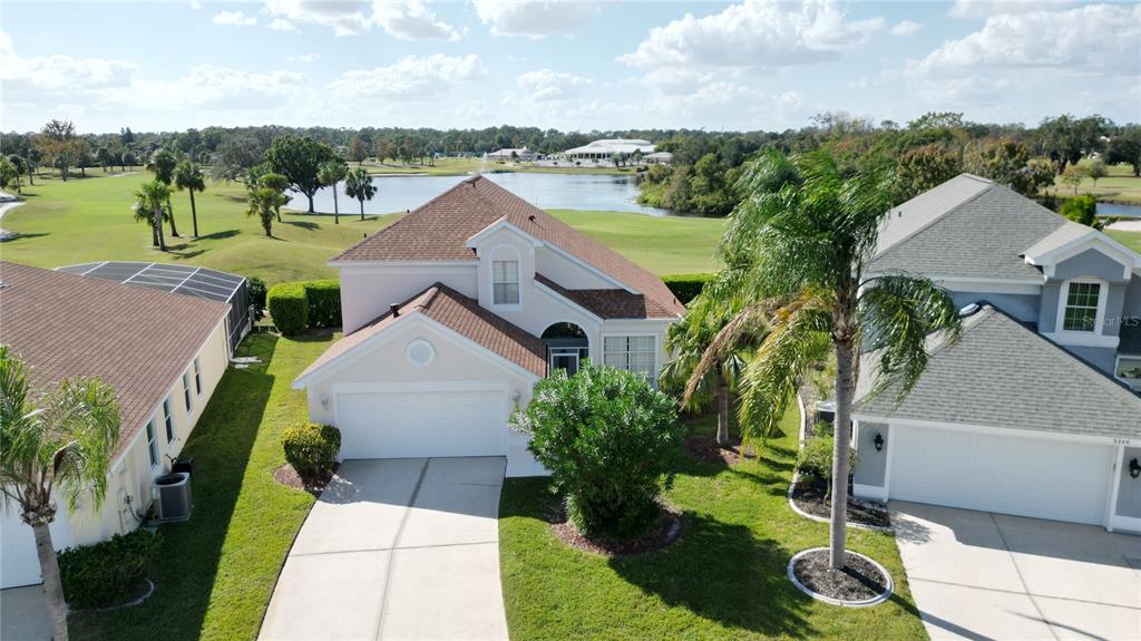 an aerial view of house with yard