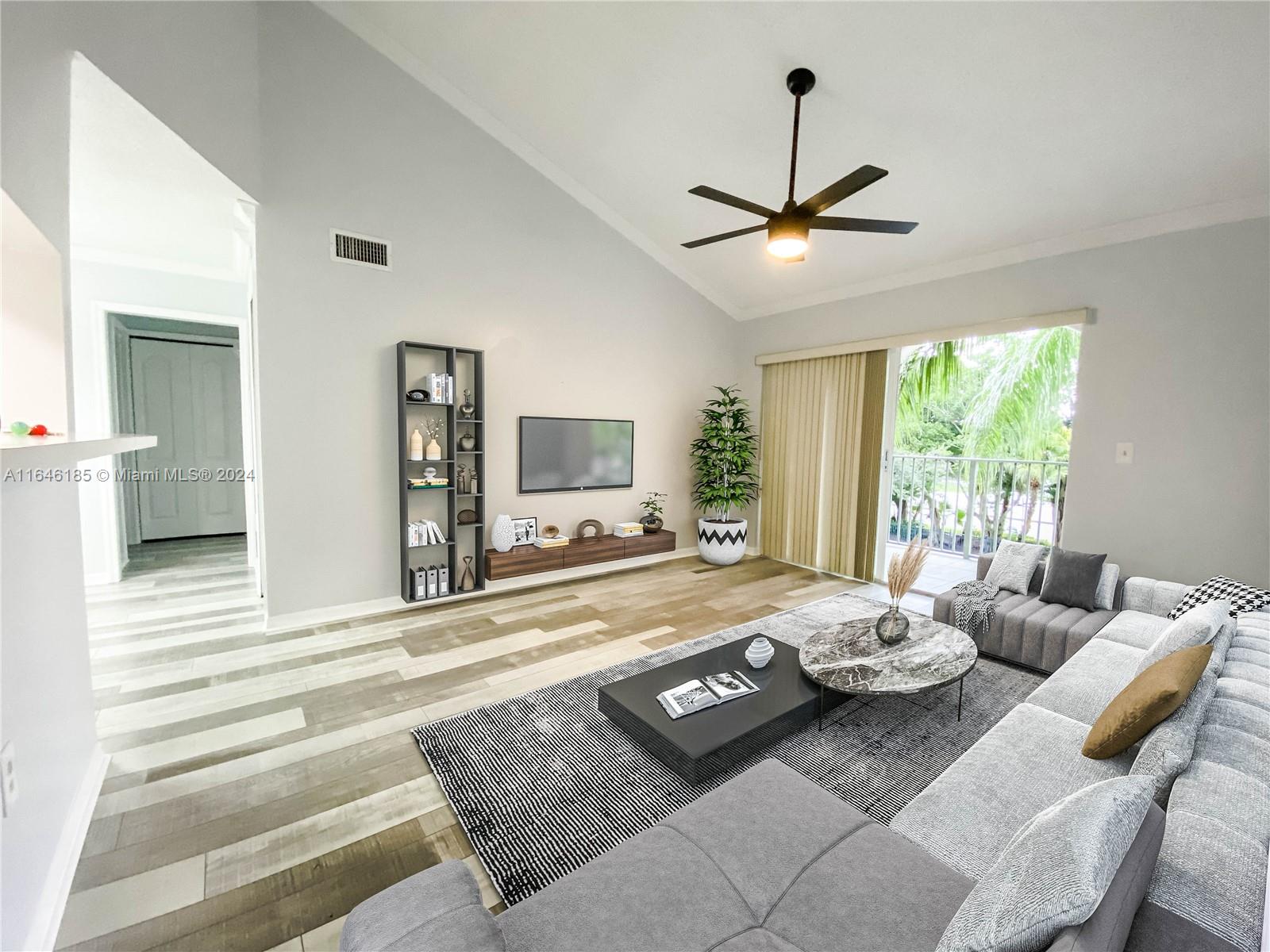 a living room with furniture and a flat screen tv