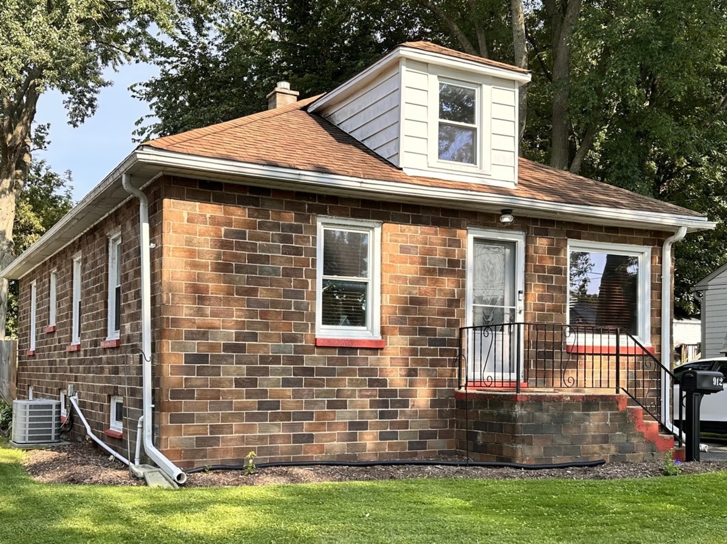 a front view of a house with yard