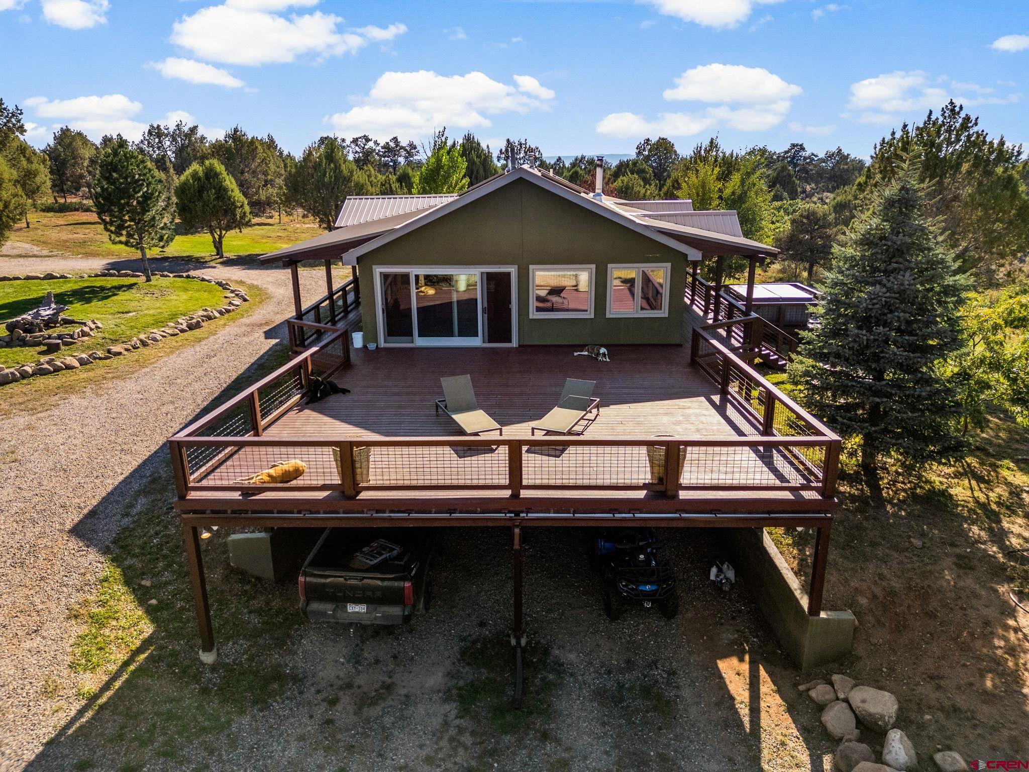 a front view of a house with wooden fence