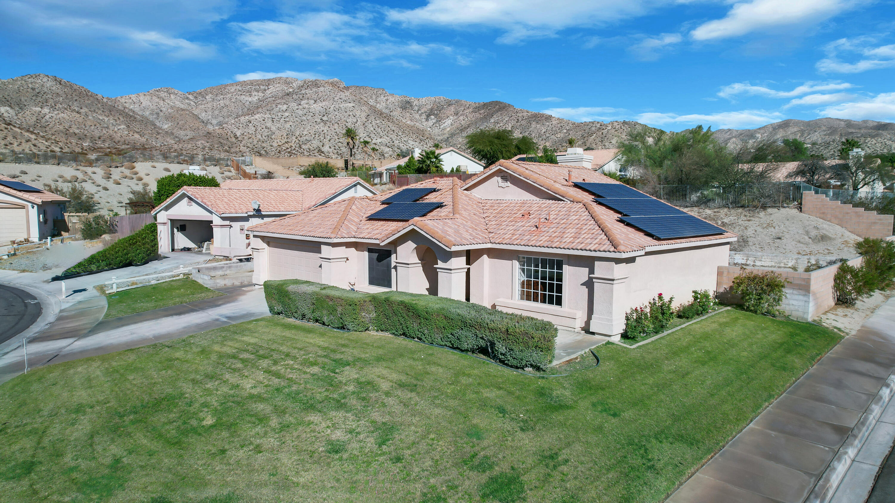 a aerial view of a house with a big yard