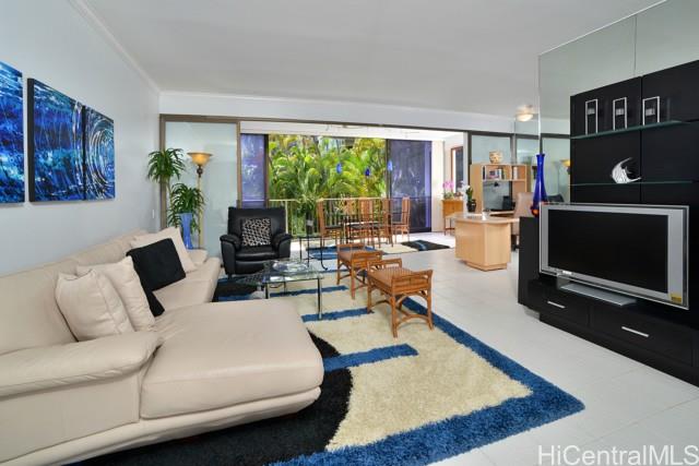 a living room with furniture rug and window