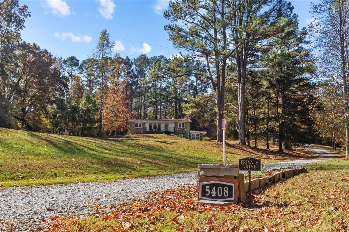 Gorgeous home set far off the road with a picturesque view from the long driveway