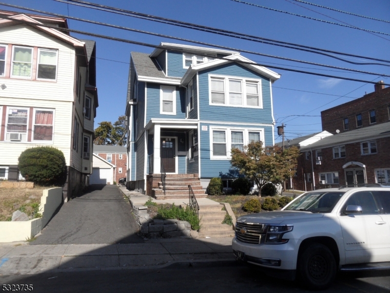 a front view of a house with outdoor space