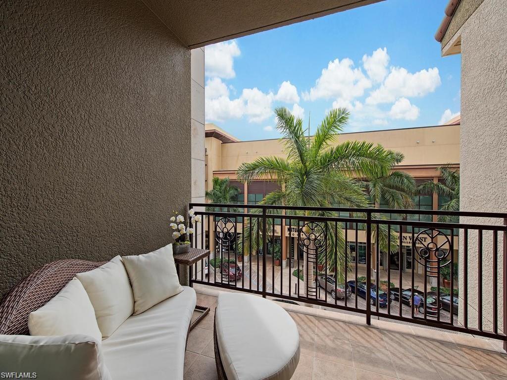 a view of a balcony with furniture