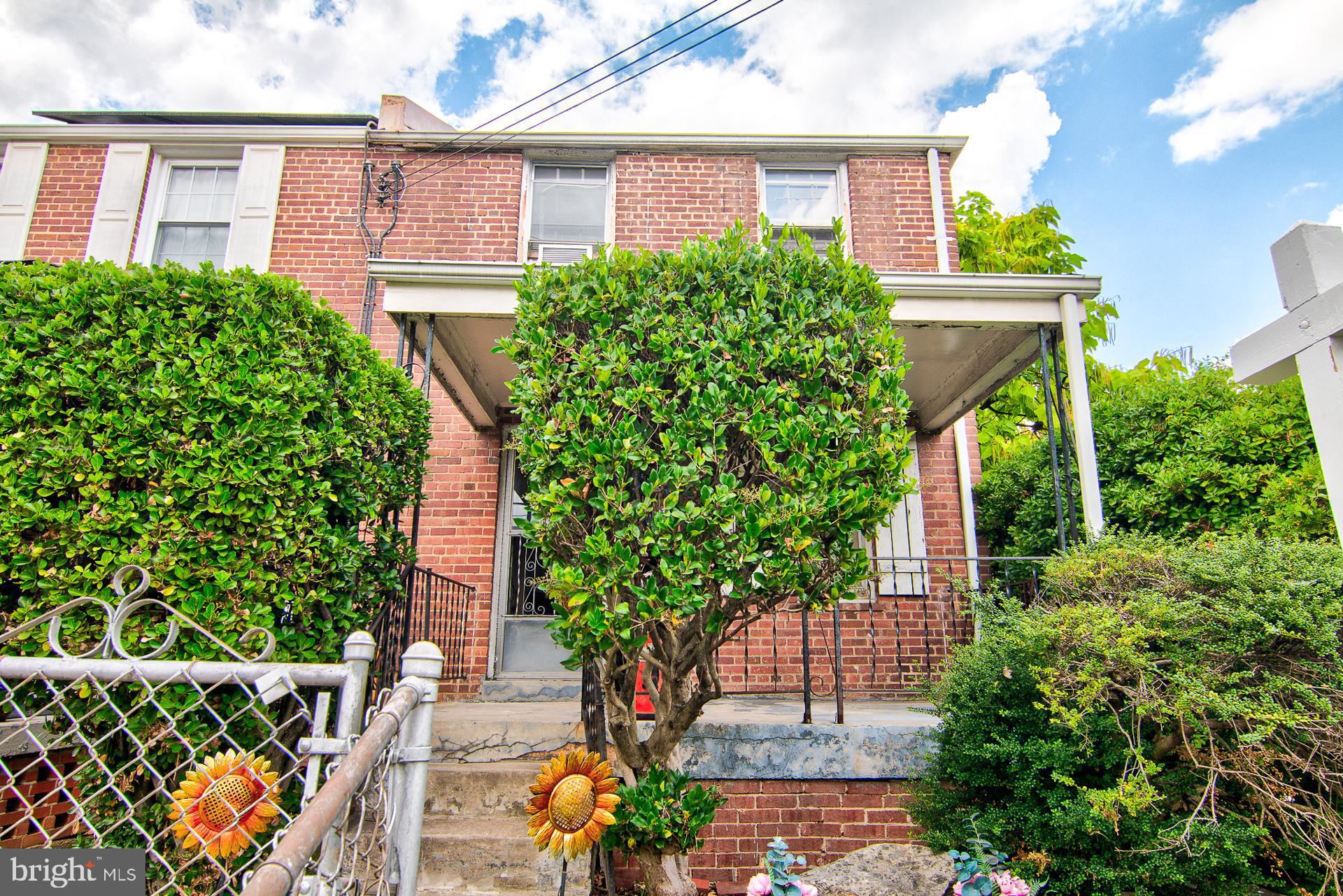 front view of a house with a garden