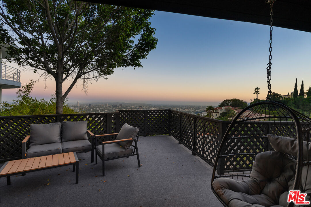 a view of a roof deck with couches