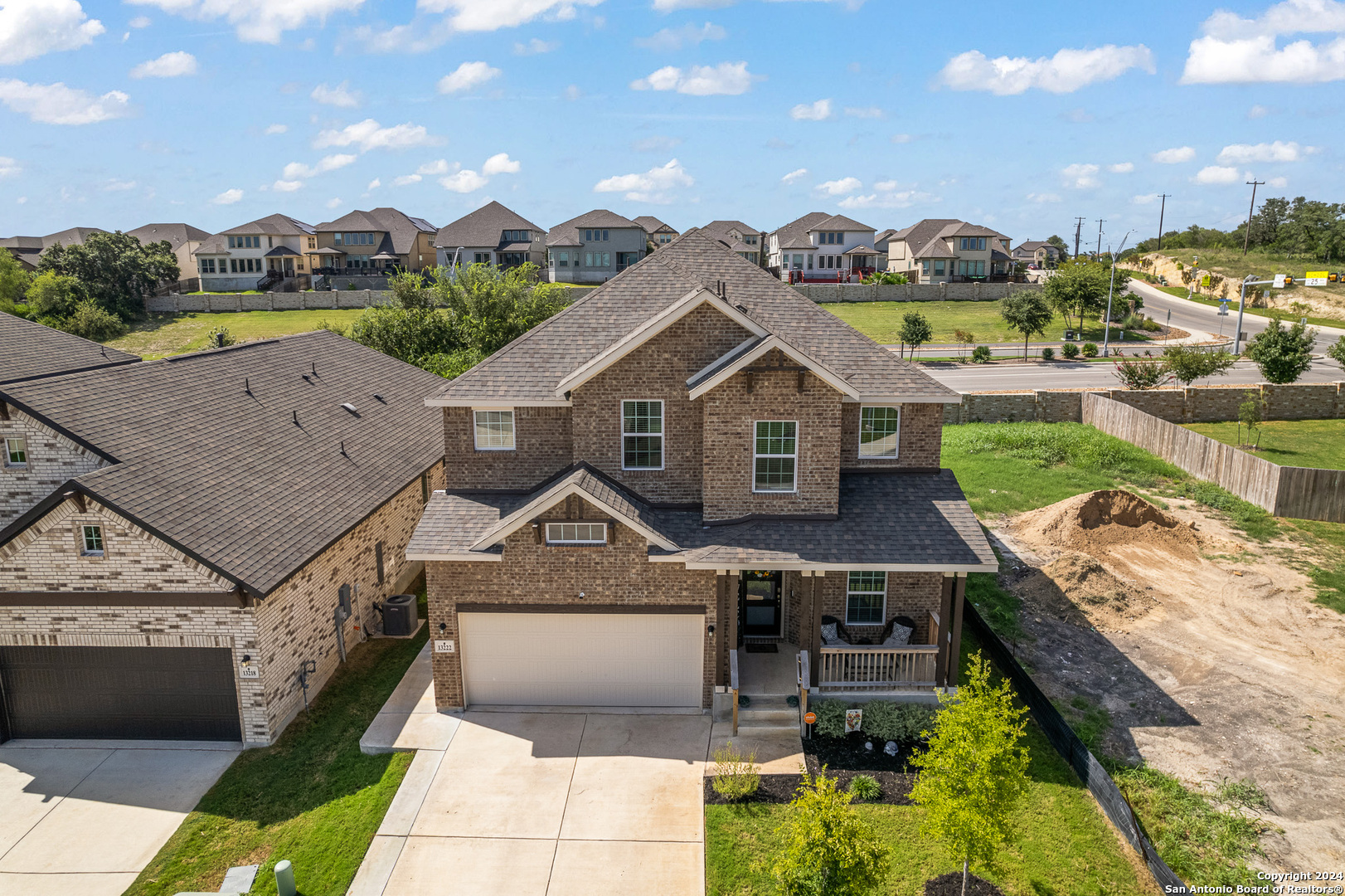 a aerial view of a house with a big yard