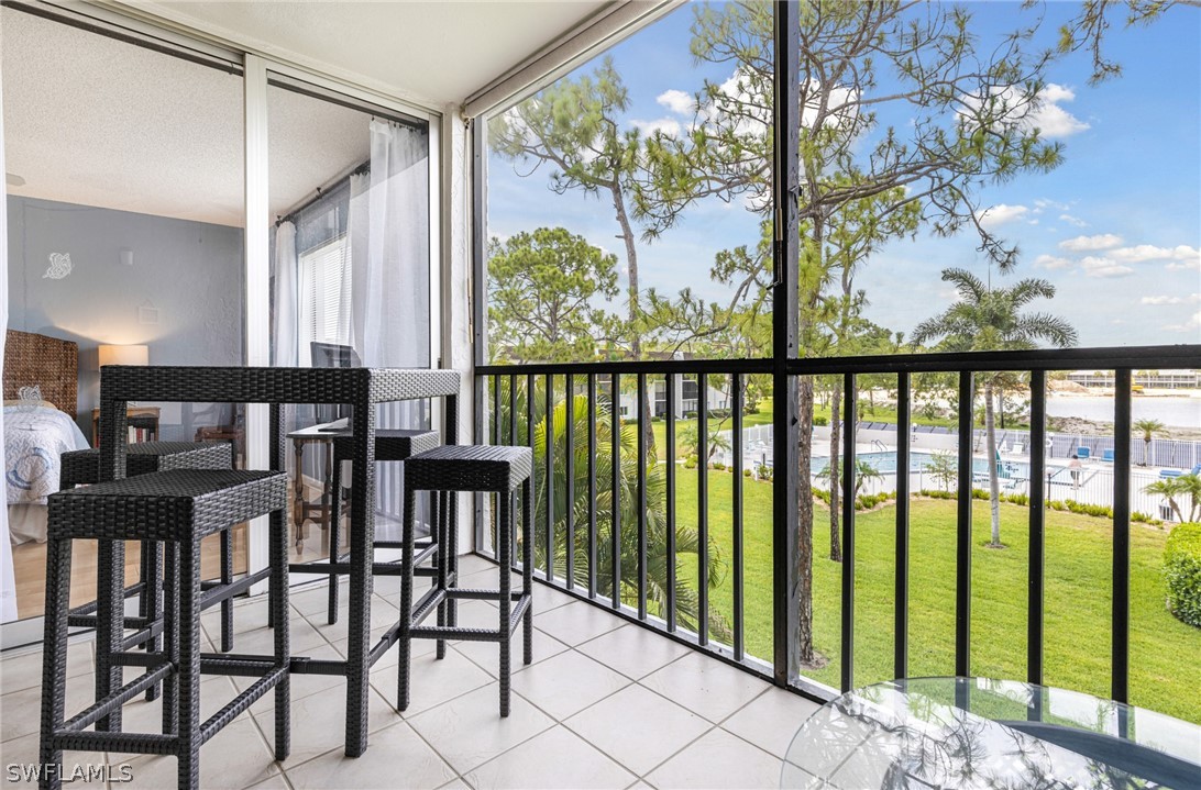 a view of a chairs and table in patio