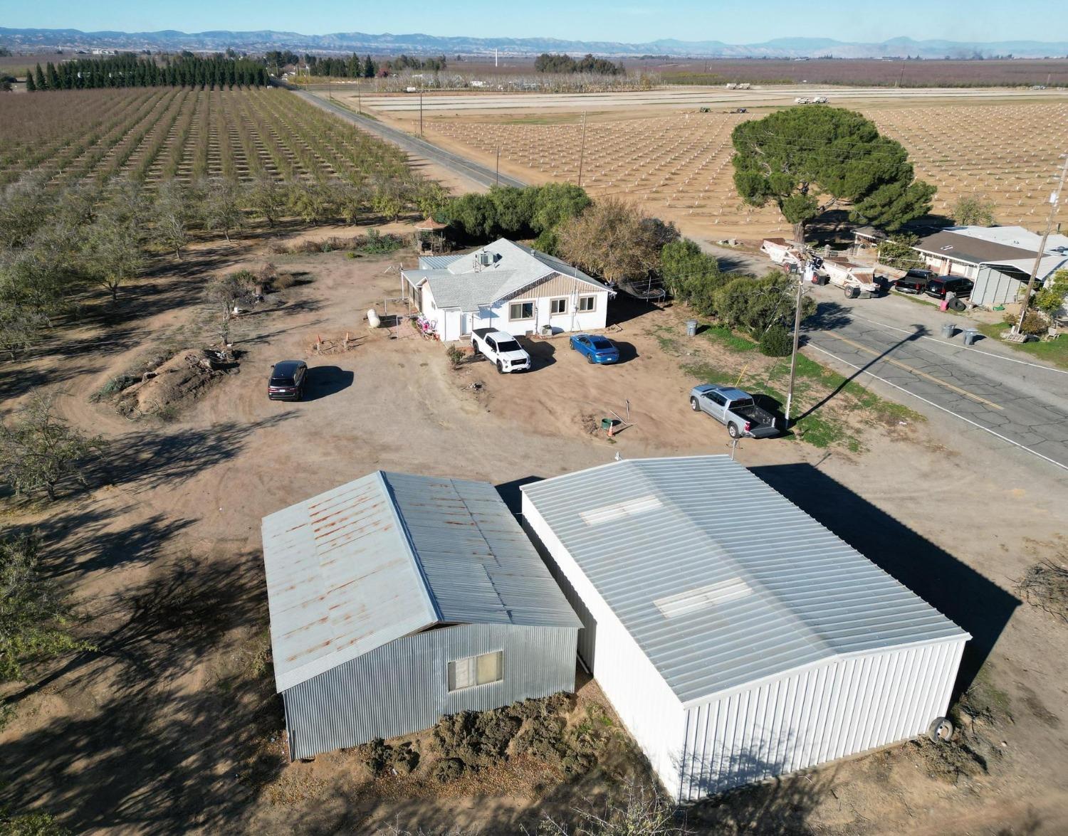 an aerial view of a house with a ocean view