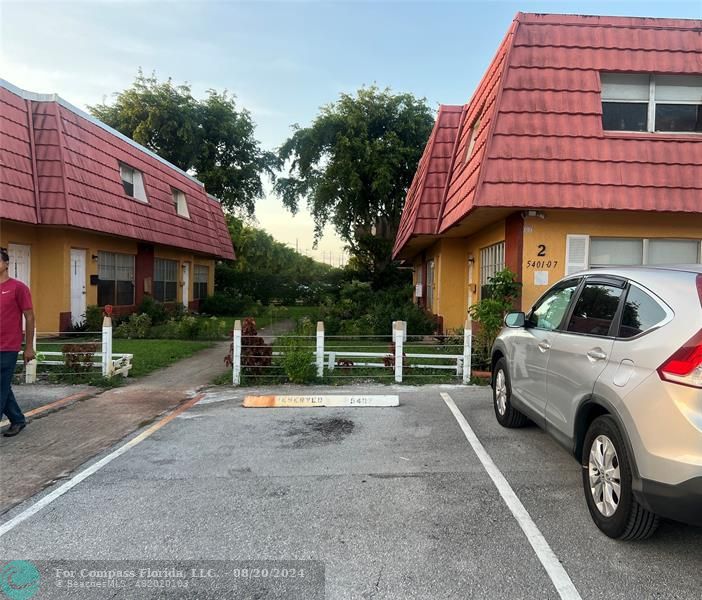 a car parked in front of a house