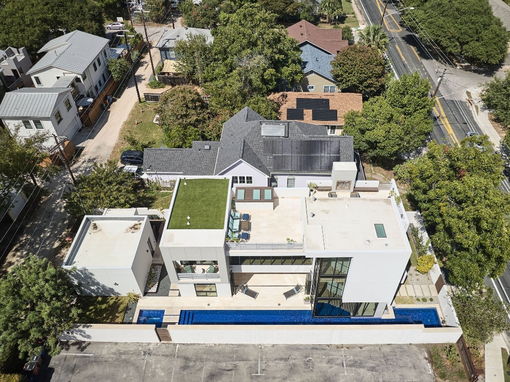 an aerial view of residential houses with outdoor space