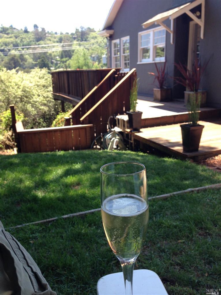 a view of a chairs and table in the patio