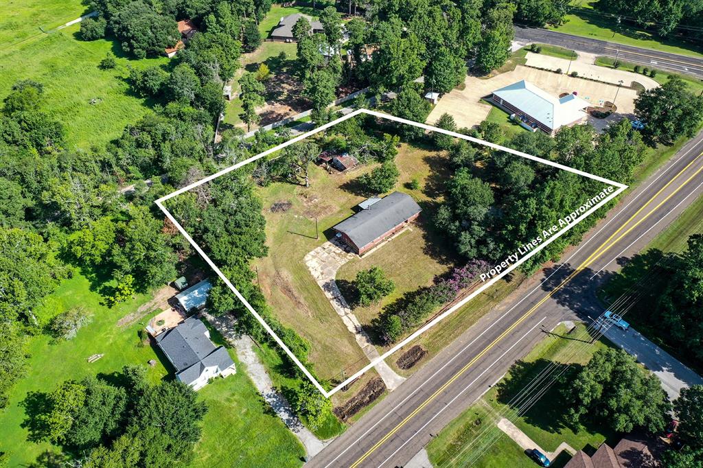 an aerial view of house with a street