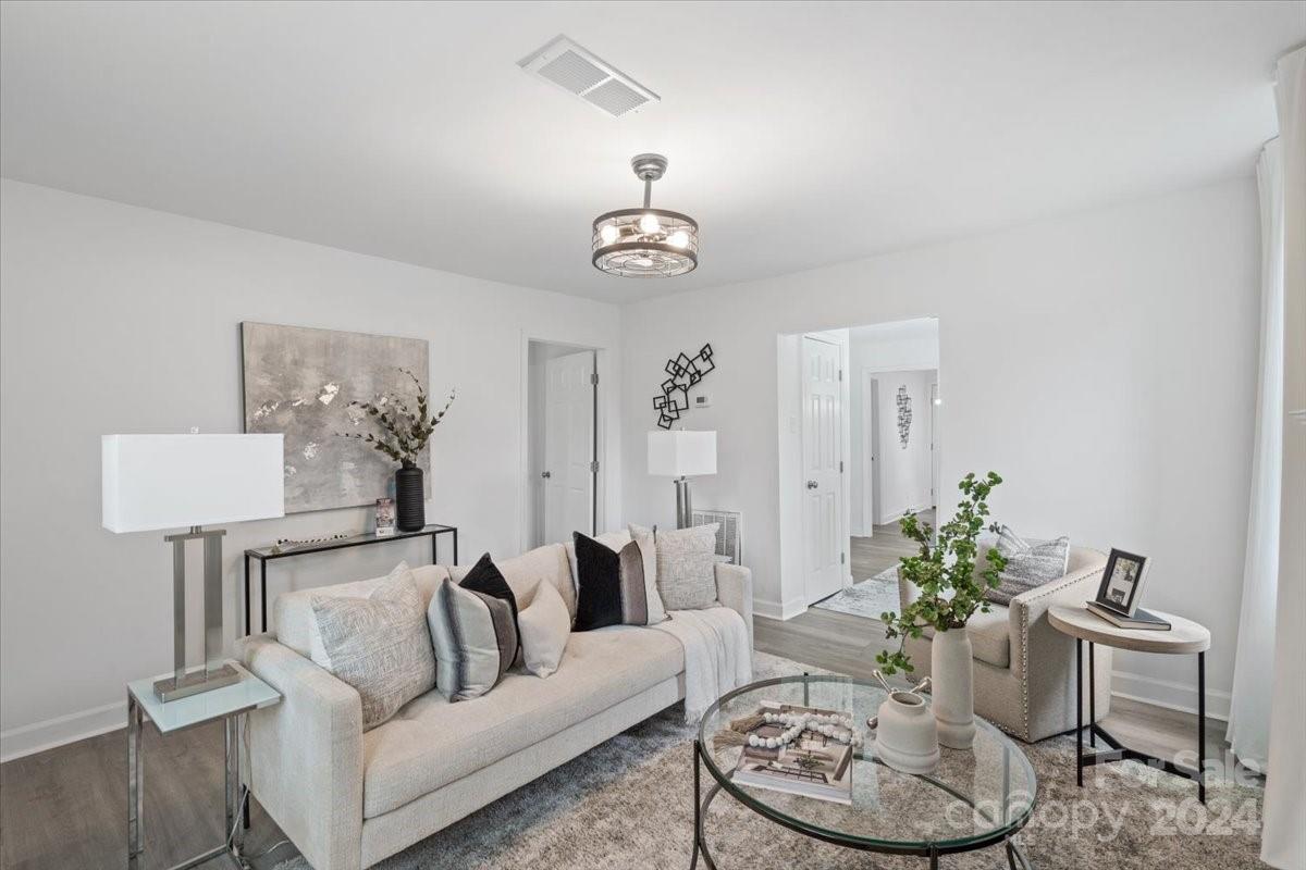 a living room with furniture and a table